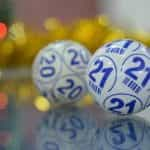 Two numbered bingo lottery balls.