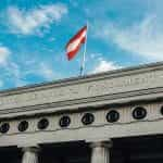 Austrian flag flying over the Hofburg Palace in Vienna.